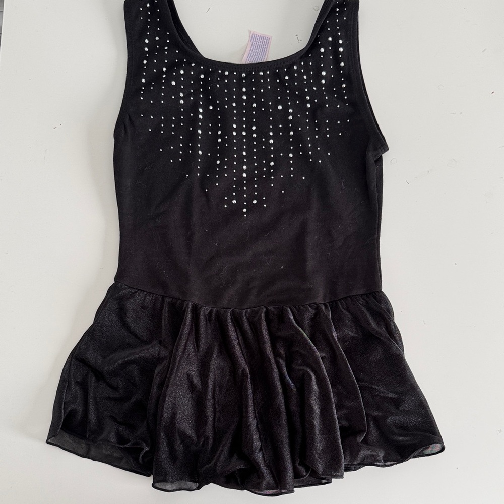 More than Magic black leotard with attached skirt. Rhinestone front. Size Large